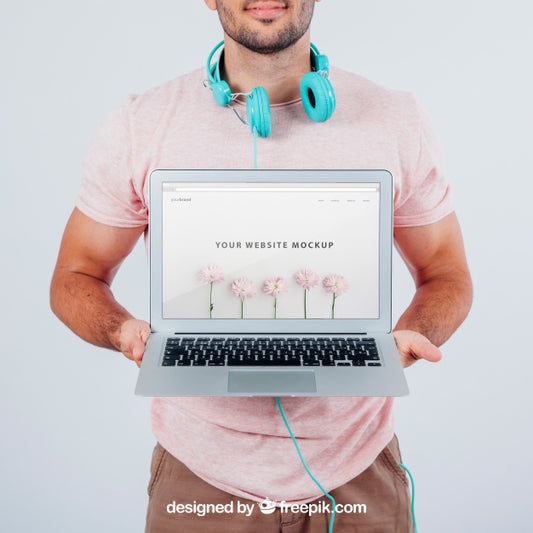 Free Modern Young Guy Holding Laptop'S Mock Up Psd