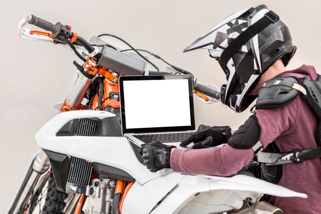 Free Motorcyclist Holding Laptop Psd – CreativeBooster