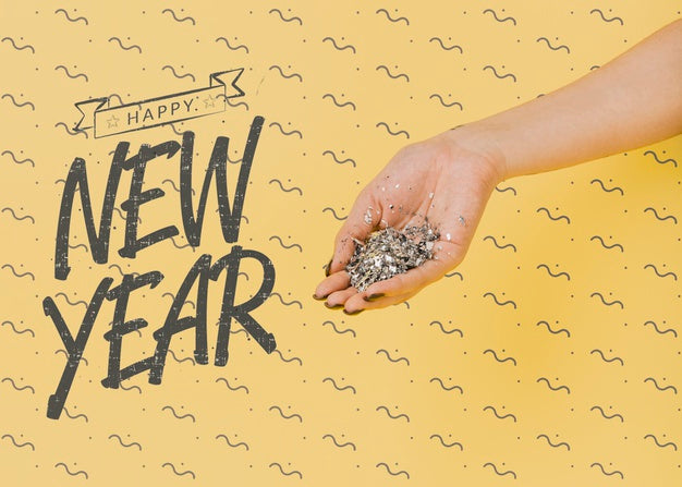 Free New Year Lettering With Person Holding Silver Confetti Psd