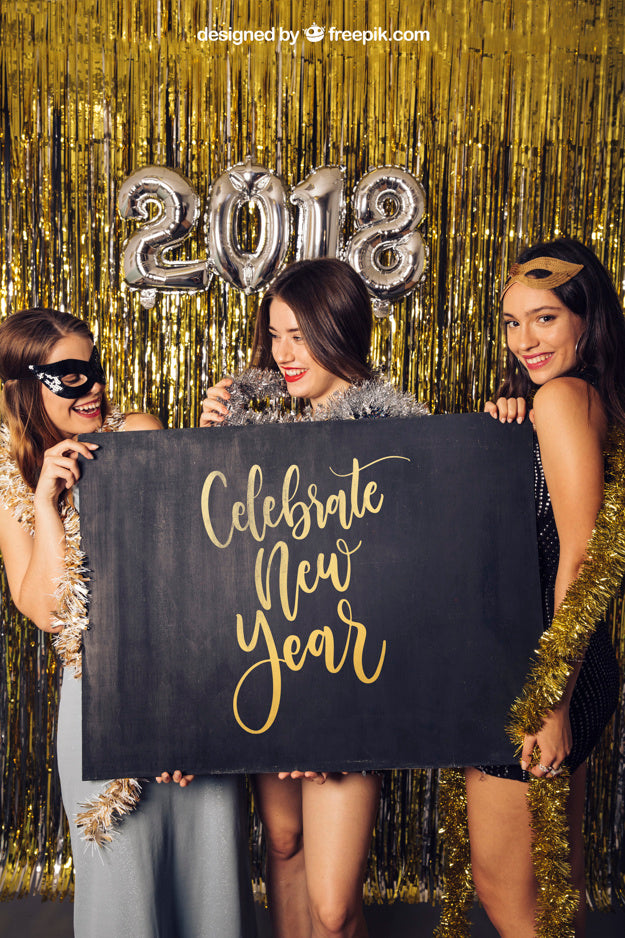 Free New Year Mockup With Three Girls Showing Board Psd
