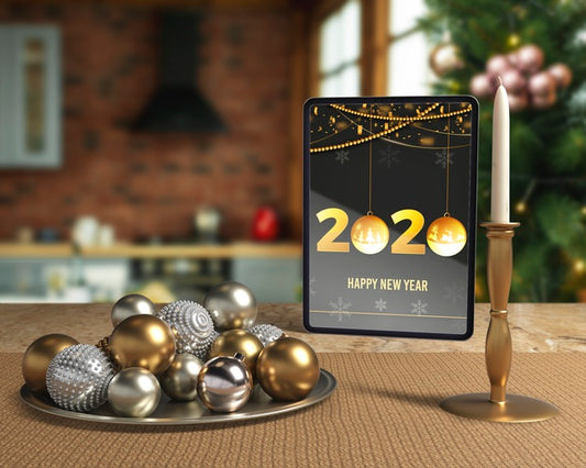 Free New Year Night Decorations Beside Tablet Psd