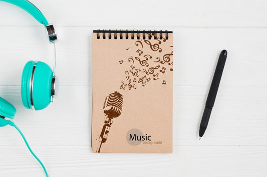 Free Notebook For Music Notes With Headphones Beside Psd