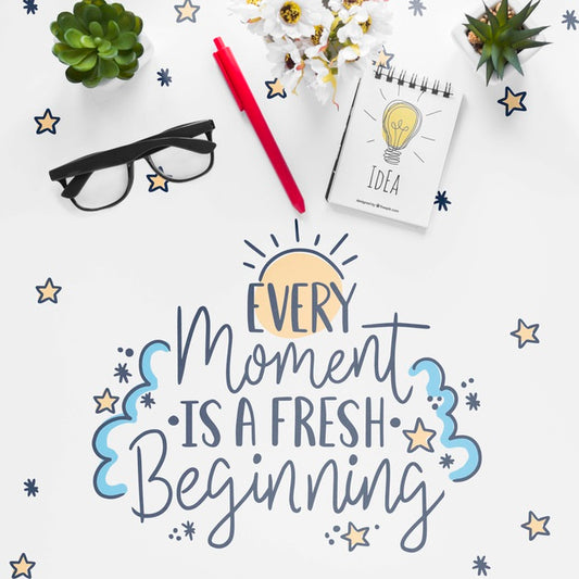 Free Notebook Little Plants And Motivational Message On White Table Psd