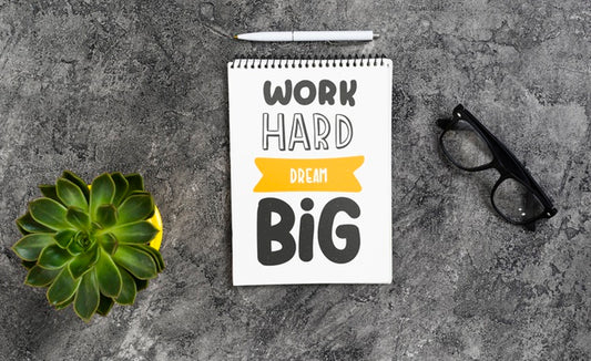 Free Notebook On Desk With Positive Message Psd