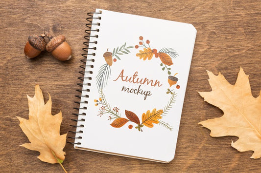 Free Notebook With Acorns And Leaves Beside Psd