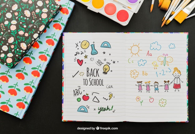 Free Notebook With Hand Drawings And School Materials Psd