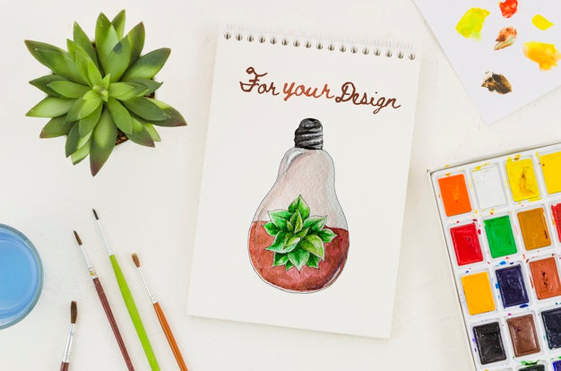 Free Notebook With Realistic Draw And Acrylic Pallette Beside Psd
