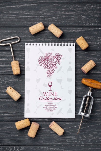 Free Notebook With Wine Stoppers On Table Psd