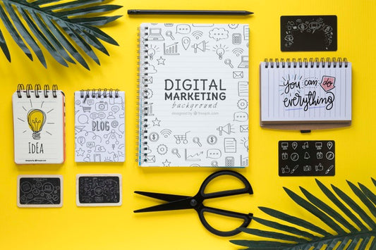 Free Notebooks Leaves And Scissors On Yellow Desk Psd