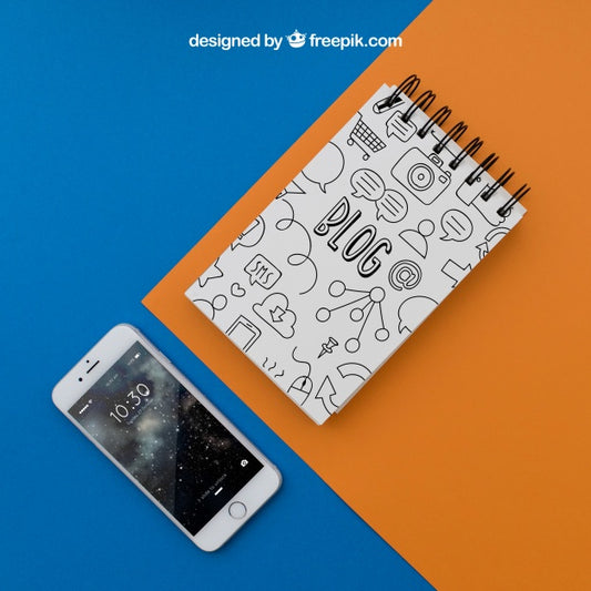 Free Notepad And Smartphone On Orange And Blue Background Psd
