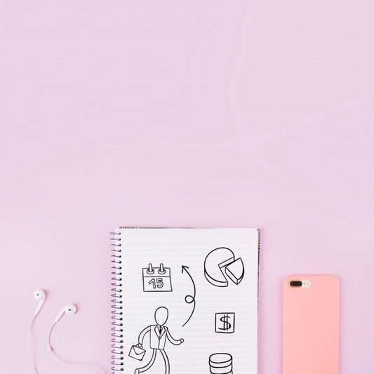 Free Notepad Mockup Next To Smartphone And Earphones Psd