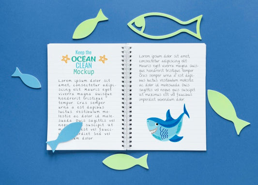 Free Ocean Day Mock-Up Notebook Surrounded By Fish Psd