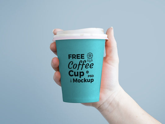 Free Paper Coffee Cup In Hand Mockup