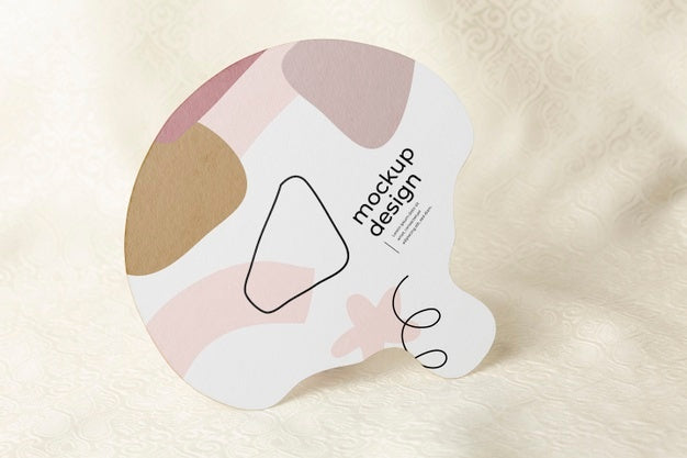 Free Paper Mock-Up Hand Fan On Textile Psd