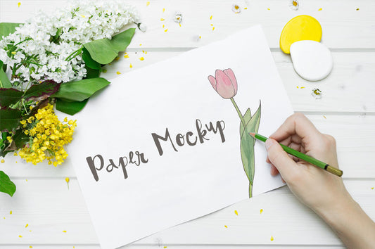 Free High Resolution White Sketch Paper Mockup with a Hand Drawing