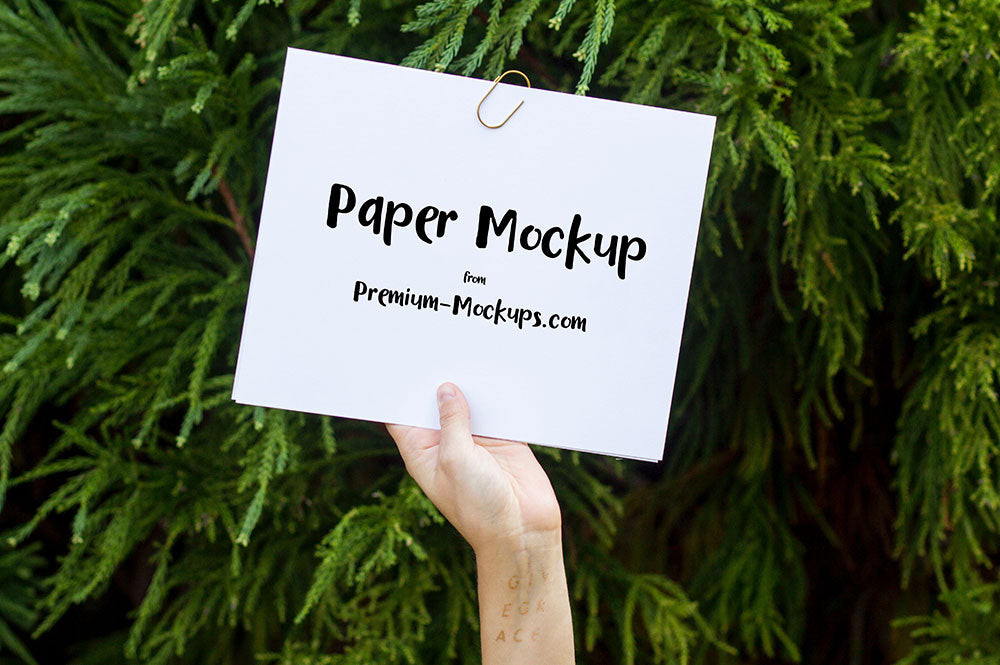 Free Empty White Paper in a Hand PSD Mockup