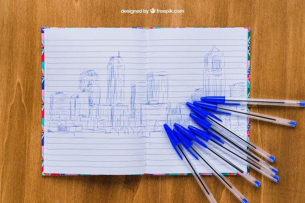Free Pens And Notebook On Wooden Table Psd
