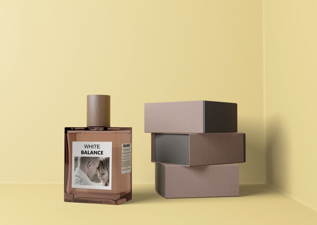 Free Perfume Beside Stack Of Boxes Psd