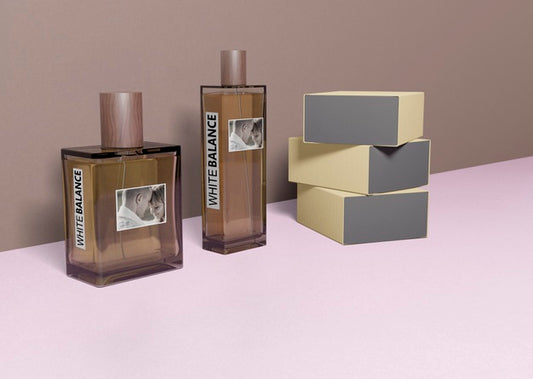 Free Perfume Boxes Stacked Beside Perfume Bottles Psd