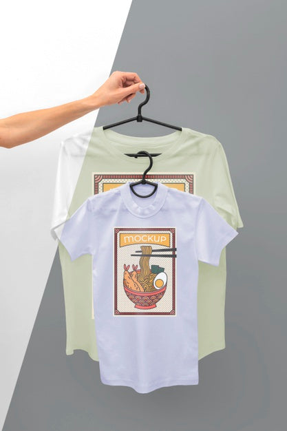 Free Person Holding A Japanese T-Shirt Mock-Up Psd