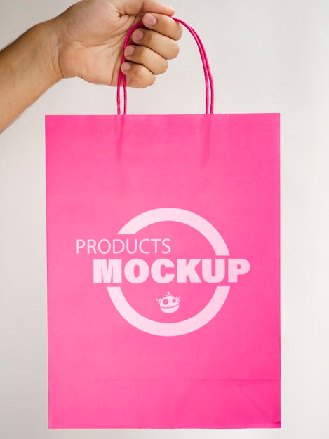Free Person Holding A Pink Paper Bag Psd