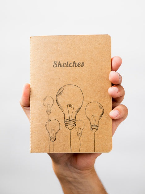 Free Person Holding A Sketch Book Psd