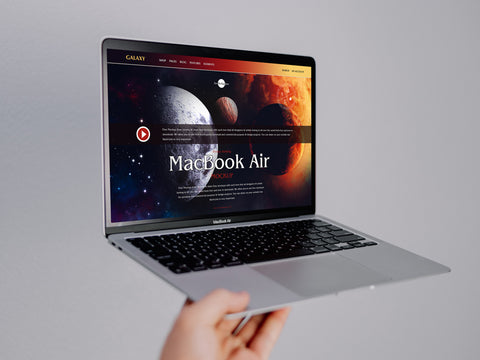 Free Person Holding Macbook Air Mockup