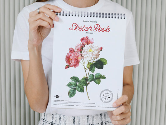 Free Person Showing Sketch Book Mockup