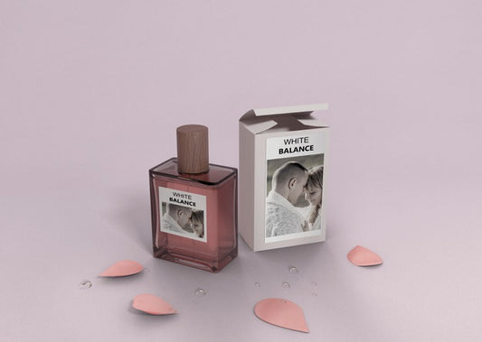 Free Petals And Perfume Bottle On Table Psd