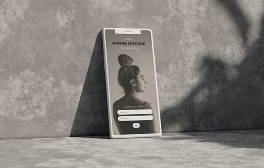 Free Phone Mockup On Concret Wall With Shadow Psd
