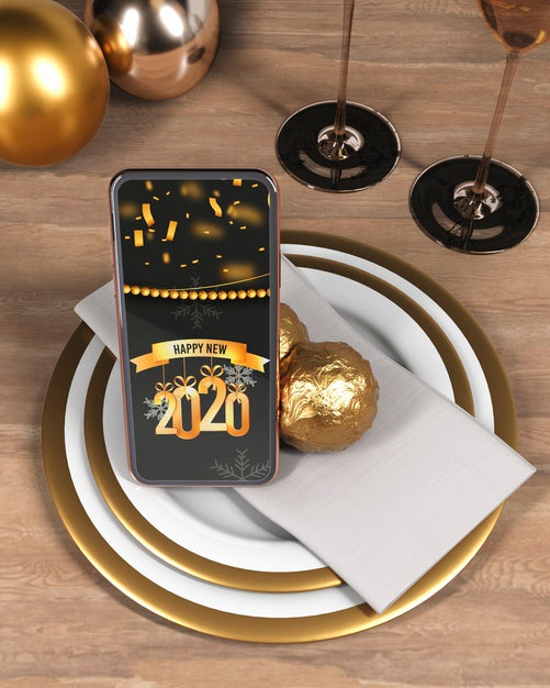 Free Phone With Message For New Year On Plate Psd