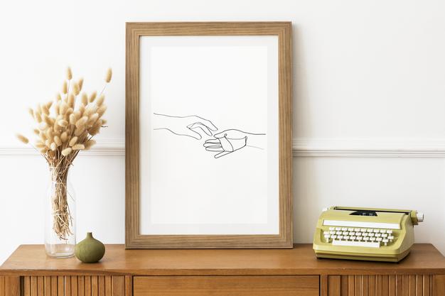 Free Picture Frame Mockup On A Wooden Sideboard Table By A Typewriter Psd
