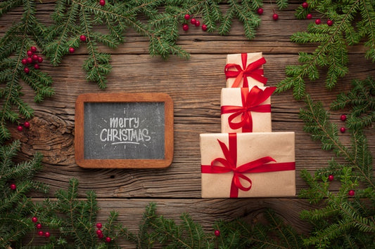 Free Pile Of Gifts And Christmas Pine Leaves Psd