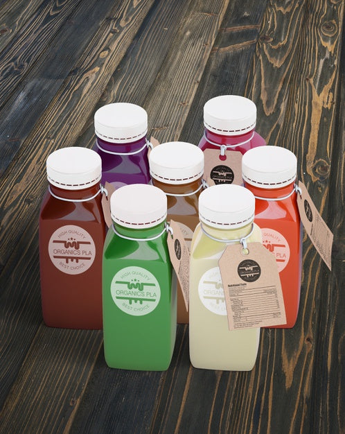 Free Plastic Bottles With Different Fruit Or Vegetable Juices With Labels Psd