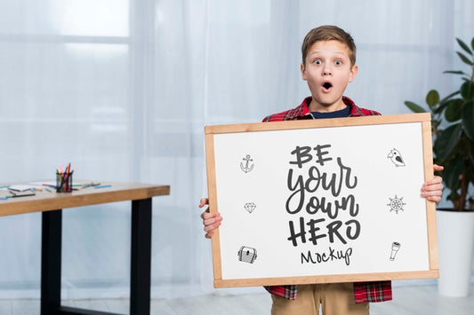 Free Portrait Of Child Holding Mock-Up Sign Psd
