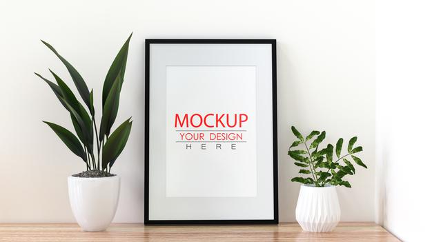 Free Poster Frame Mockup On The Wall With Plant Psd