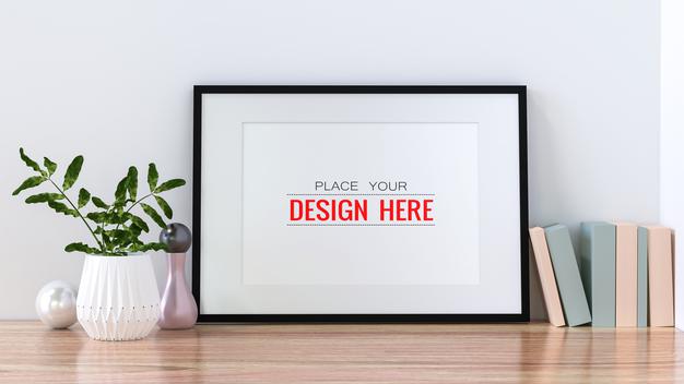 Free Poster Frame Mockup On The Wall With Plant Psd