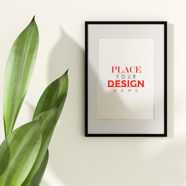 Free Poster Frame Mockup On The Wall With Plant Psd