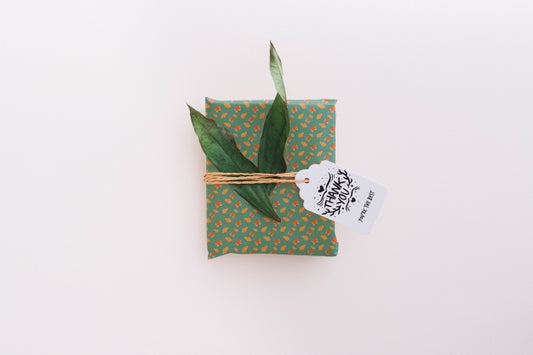 Free Present Box Mockup With Leaves Psd
