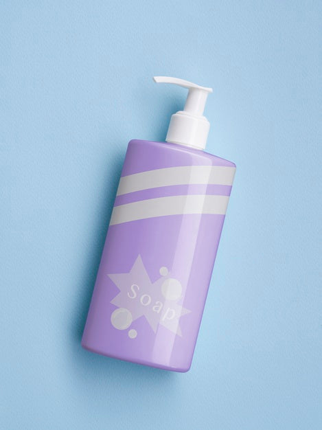 Free Purple Liquid Soap Bottle On Blue Background Psd