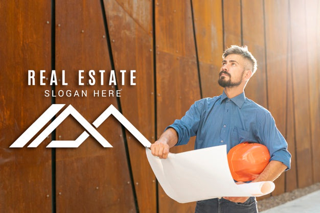 Free Real Estate Agent Looking Up And Holding Plans Psd