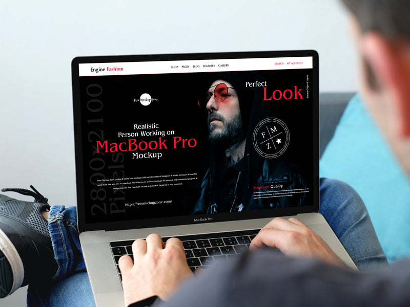 Free Realistic Person Working On Macbook Pro Mockup – CreativeBooster