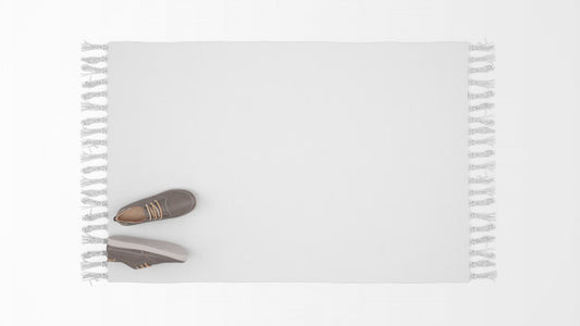 Free Realistic White Carpet With A Pair Of Shoes On Top View Psd
