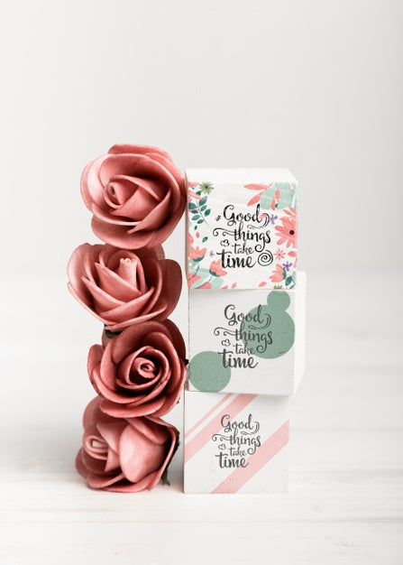 Free Red Roses Next To Colorful Blocks Psd