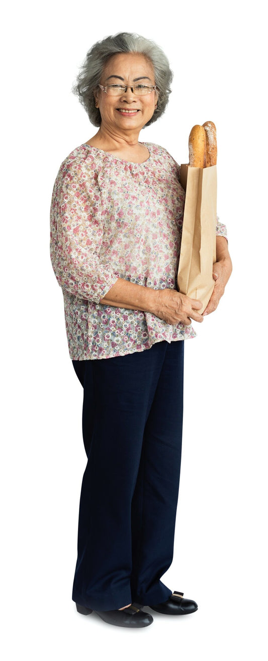 Free Senior Adult Woman Holding A Bag Of Bread