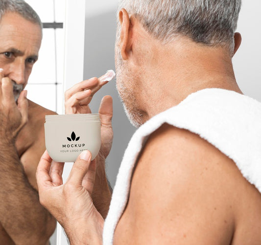 Free Senior Man Applying Face Cream Psd