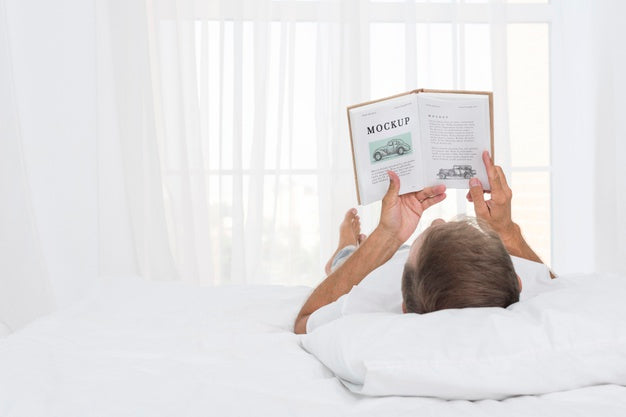 Free Senior Man Reading In Bed Psd