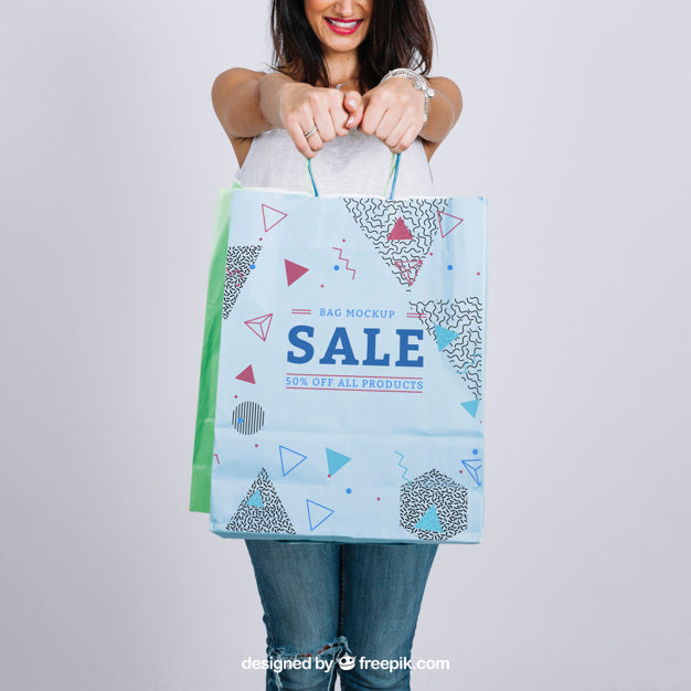 Free Shopping Bag Mockup With Young Woman Psd