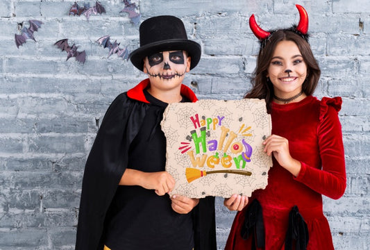 Free Siblings Showing A Happy Halloween Card Medium Shot Psd