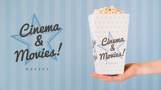 Free Side View Of Hand Holding Cup Of Popcorn Psd